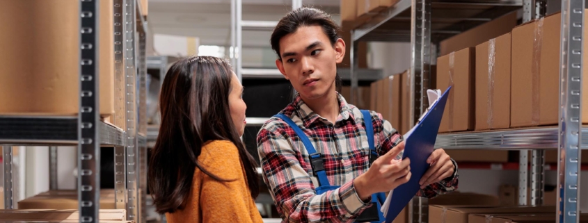 Two employees working in a fulfillment center