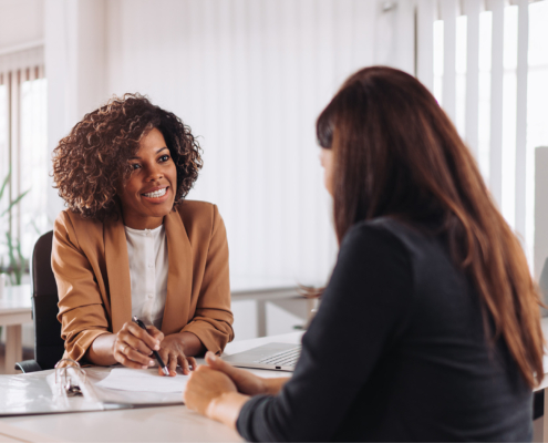 Woman consulting with a female financial manager at the bank