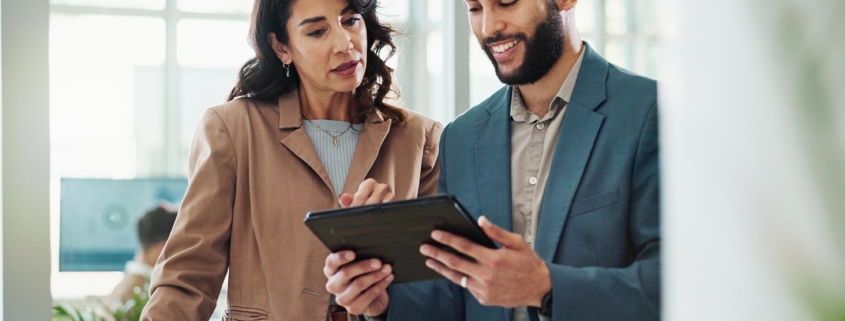 Two people talking in office