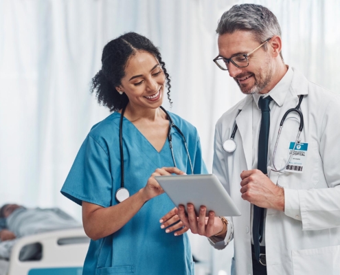 Medical workers looking at tablet